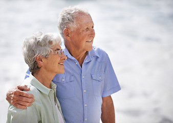 Image showing Senior, couple and look happy at beach for retirement vacation or anniversary to relax with love, care and commitment with support. Elderly man, woman and together by ocean for peace on holiday.