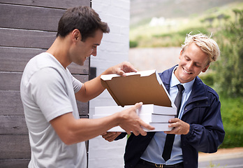 Image showing Men, delivery and giving pizza boxes to customer at gate, home and outdoor for service, fast food and meal. People, happy and together with cardboard package for order by garden at house in Cape Town