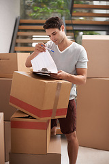 Image showing Man, boxes and sign with clipboard in home, reading and check documentation for delivery, invoice and cargo. Person, cardboard and package with paperwork for service, signature and stock in new house