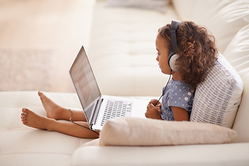 Image showing Kindergarten, kid and elearning on laptop in home with online class, video and girl with headphones. Virtual, education and child with computer on sofa in house for development of language knowledge