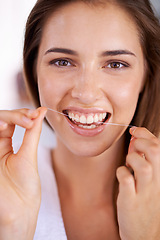 Image showing Clean, dental and portrait of woman with floss for health, wellness and grooming routine for hygiene. Oral care, happy and female person with dentistry tool for teeth or mouth treatment in bathroom.