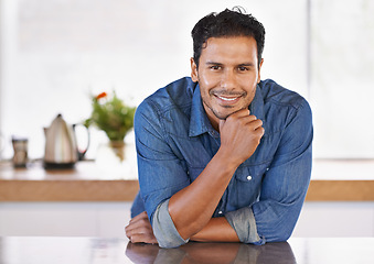 Image showing Calm, home and man relax in portrait on kitchen counter in modern house with confidence in Mexico. Mexican, person and pride for property and happy in apartment, real estate or homeowner in morning