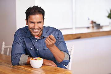 Image showing Portrait, smile and man eating fruit salad in home at table for healthy diet, nutrition or wellness at breakfast in the morning. Face, happy person and hungry for food, yogurt or organic strawberry