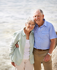 Image showing Senior, couple and happy portrait at beach for retirement vacation or anniversary to relax with love, care and commitment with support. Elderly man, woman and together by ocean for peace on holiday.