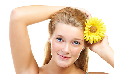 Image showing Skincare, portrait and happy woman in studio with sunflower in her hair for natural cosmetics on white background, Flower, smile or model face with wellness, glowing skin or organic beauty treatment