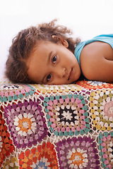 Image showing Relax, portrait and sleepy girl on a bed with comfort, peace and drifting on a quilt blanket in her home. Resting, face and kid in a bedroom for calm, afternoon or vacation, holiday or weekend nap