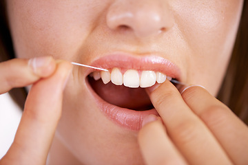Image showing Floss, oral care and closeup of woman teeth with health, wellness and clean routine for hygiene. Dental, grooming and zoom of young female person with dentistry mouth treatment for fresh breath.