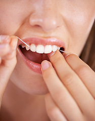 Image showing Floss, dental and closeup of woman teeth with health, wellness and clean routine for hygiene. Oral care, grooming and zoom of female person with dentistry tool for mouth treatment for fresh breath.