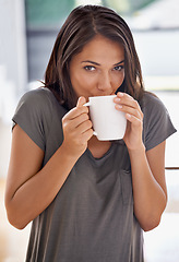 Image showing Woman, coffee and mug with kitchen, drink and morning for home routine. Person, cup and tea with house, beverage and aroma for relax and caffeine or taste portrait to enjoy break with happiness