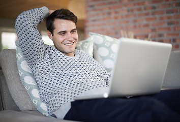 Image showing Relax, happy or man on laptop for streaming movies, article post or networking in home to research. Email, smile or male person on sofa typing online on technology for digital blog or news on website
