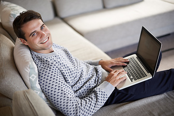 Image showing Above, portrait or man on laptop for remote work, article post or networking in home to relax. Research, smile or happy male person on sofa typing online on technology for business, email or news