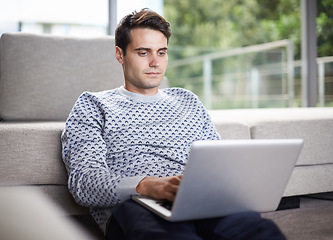 Image showing Man, home and couch with typing on laptop for remote work as freelancer with startup business and online research. Male person, living room and browse on internet with information for project