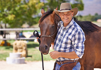 Image showing Man, farmer and happy with horse in ranch for care with bonding, feeding and support in Texas. Mature, male person and cowboy with smile for domestic animal in countryside for agriculture work.