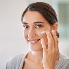 Image showing Woman, portrait and skincare cream in home with smile, thinking for choice, health and cosmetics product. Girl, person and happy with lotion for facial skin with beauty, results or wellness benefit