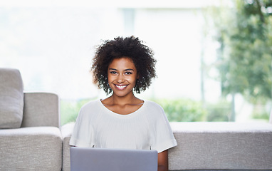 Image showing Portrait, laptop and African woman in lounge, smile and online shopping from home. Internet, ecommerce and shopping for fashion clothing, browsing and connected for happy female with natural afro