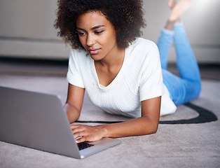 Image showing Reading, computer and woman on floor working on freelance creative project in living room. Relax, technology and young female designer typing on laptop for research on rug in modern apartment.