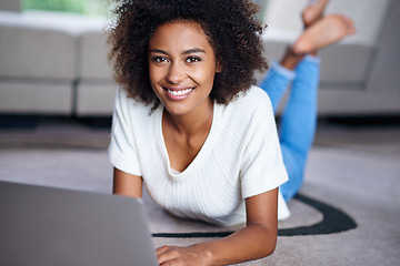 Image showing Relax, laptop and portrait of woman on floor working on freelance creative project in living room. Happy, technology and African female designer typing on computer for research on rug in apartment.