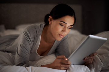 Image showing House, bedroom and woman reading with tablet on app, online with connection to internet. Night, female person and girl download ebook for romance with technology to relax on bed, break and weekend