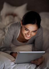 Image showing House, bedroom and woman with smile for tablet on social media, chatting and texting on site of app. Bed, female person and girl with technology for reading ebook to relax and online with internet