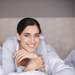 Image showing Portrait, bed and smile of happy woman, bedroom and home for comfort and sleep. Duvet, relax and bedding in room for rest for fatigue, wellness and refresh or joy on weekend chill in pyjamas