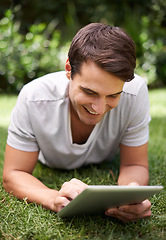 Image showing Man, tablet and backyard reading or relax connection or browsing social media on weekend, subscription or online. Male person, garden and nature rest for web entertainment, researching or internet