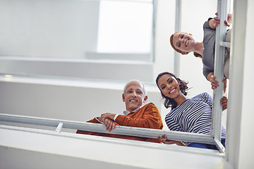 Image showing Business people, colleagues and bottom view with smile, man and women looking at stairs. Professional team, diversity or group and standing together for break and conversation in workplace or office