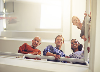 Image showing Men and women, colleagues and bottom view with smile, business people and looking at stairs. Professional team, diversity and standing for break, flare and conversation in workplace or office