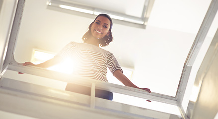 Image showing Low angle, businesswoman and portrait for confidence by stairs, office and professional by railing. Female person, happy and entrepreneur pride for startup company, consultant and work opportunity