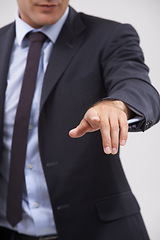 Image showing Businessman, hand and pointing with interface for touch, UX or UI on a gray studio background. Closeup of young man, user or employee with interaction for virtual technology, push or click on icon