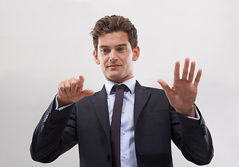 Image showing Business, man and confident with a digital interface in studio on white background for company research and ideas. Male person, technology and click for user experience with digital transformation.