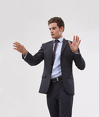 Image showing Future, interface and touchscreen with businessman user in studio on white background for metaverse access. Corporate, digital transformation and software with young employee in suit for networking