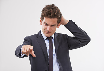 Image showing Businessman, confused and hand pointing with digital interface, UI or display on a white background. Young man, user or employee in doubt or interaction on virtual technology, push or click on mockup