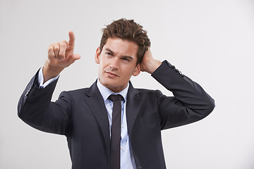 Image showing Confused, thinking or businessman on touchscreen in studio on white background for metaverse access. Fail, air and software system with finger pointing, doubt and employee in suit for networking