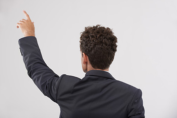 Image showing Business, man and touching a digital interface in studio on white background for company research and ideas. Back view, male person and click for user experience with technology and innovation