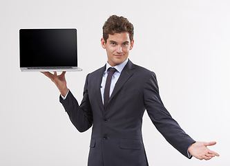 Image showing Portrait, screen and man holding a laptop, presentation or connection on white studio background. Face, employee or model with tech, internet or computer with email, showing and digital app with info