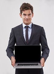 Image showing Portrait, screen and man with a laptop, connection and professional on white studio background. Face, person and model with tech, internet or employee with presentation and computer with website info