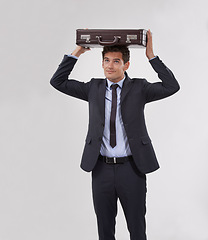 Image showing Studio, business man and briefcase on head isolated on a white background mockup space. Protection, entrepreneur and professional carrying bag, consultant and corporate employee working in a suit