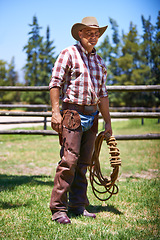 Image showing Farm, ranch and portrait of senior cowboy with rope lasso for horse, cows and rodeo animals for agriculture. Farming, nature and mature man in environment, countryside and working outdoors in Texas