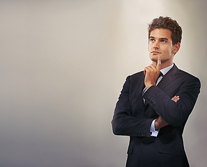 Image showing Businessman, thinking and idea with decision or choice for solution or brainstorming on a gray studio background. Young man, model or employee in wonder, contemplating or thought on mockup space
