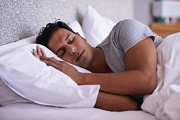 Image showing Man, care and sleeping in bed in morning, tired and peace rest on soft pillow with comfortable mattress. Healthy person, dream or relax in modern bedroom, lazy weekend or fatigue or wellness in home