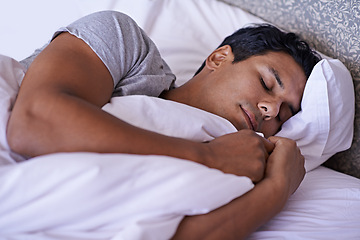 Image showing Man, tired and sleeping in bedroom in morning, quiet and peace rest on soft pillow in warm duvet. Calm person, dream and relax on bed in white bedding, fatigue and wellness on lazy weekend in home