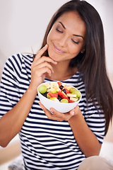 Image showing Woman, smile and fruit bowl and thinking, natural nutrition and healthy organic food. Happy, female person with snack with vitamins for skin and body wellness, balance diet or excited vegan choice