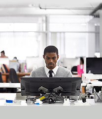 Image showing Black man, employee and intern with computer at workplace, office and professional at desk for creative career. African male person, graphic designer and illustrator working on designs on 3D printer