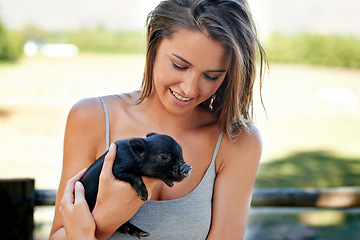 Image showing Woman, pig and happiness for wellness, charity organization and rescue center. Volunteer, smile and female person with piglet for foster care, adoption and animal sanctuary for nonprofit or ngo