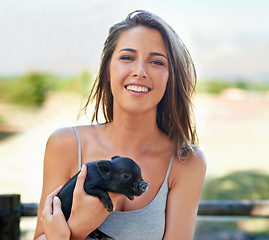 Image showing Portrait, outdoor and woman with a piglet, happy and summer with weekend break and bonding together. Face, person and girl with animal and pet with sunshine and cheerful with joy, ranch and smile