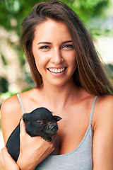 Image showing Portrait, outdoor and woman with a piglet, smile and sunshine with weekend break and bonding together. Face, person and girl with animal and pet with summer and cheerful with fun, joy and happiness