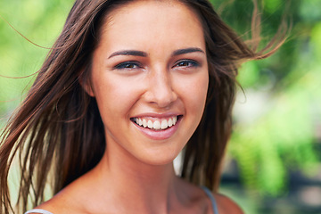 Image showing Woman, smile and wind in outdoor, portrait and closeup in natural light and skincare for cosmetics. Female person, happy and outside in summer, confidence and wellness for skin care in texas beauty