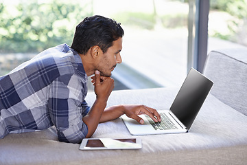 Image showing Man, technology and relax on bed while streaming movies or online show for entertainment, comfort and leisure. Male person, bedroom and digital touchscreen for browsing, connectivity and social media