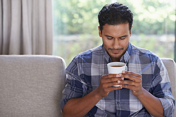 Image showing Man, couch and relax with coffee for morning, routine or solitude, comfort and calm for peace. Male person, warm beverage and aroma for satisfaction or happiness with contentment and ease in lounge.