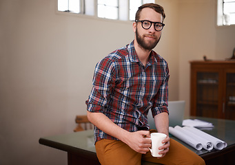 Image showing Portrait, coffee and handyman with blueprint, engineering and construction company with startup. Face, employee and entrepreneur with morning tea or design for a property and real estate in an office